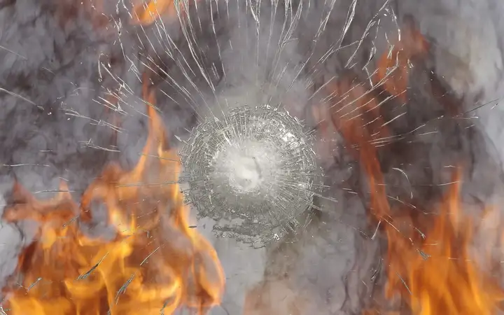 Shattered glass screen protection in front of fire