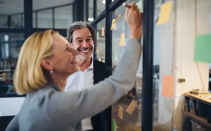 Male and female working together in a business meeting