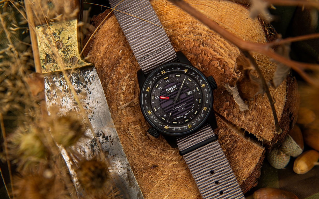 traser watch lying on a wooden disc Copyright: traser