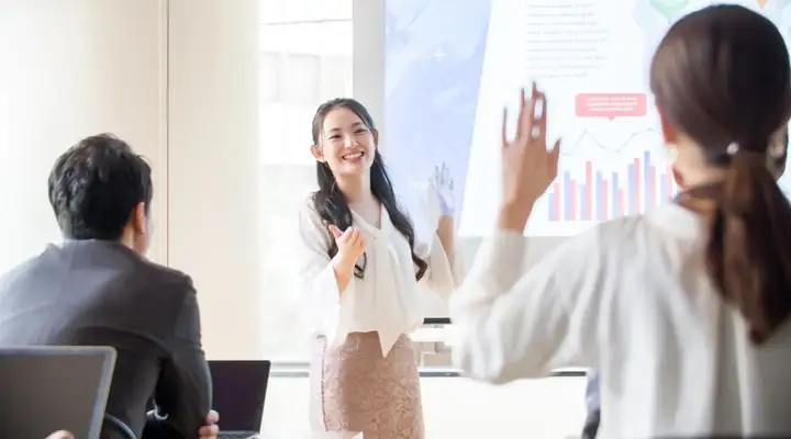 Female teacher in front of a class of students