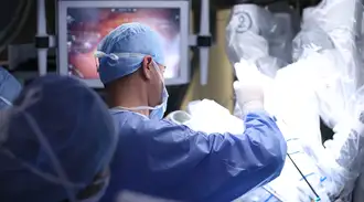 A surgeon performing a procedure with high-precision medical devices