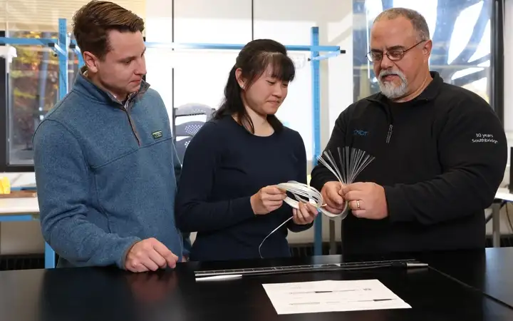 SCHOTT engineers investigating a fiber bundle