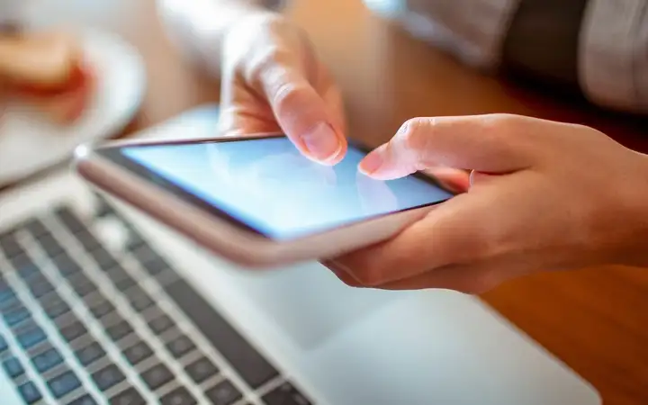 hands holding a smartphone