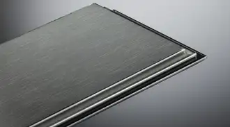 Close-up of a brushed craft glass panel featuring a raised edge on one side, set against a gradient gray background.