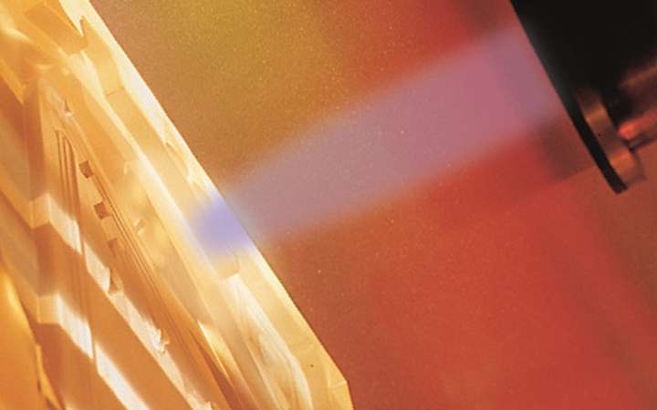 Illustration of light being focused on a component in lithography process