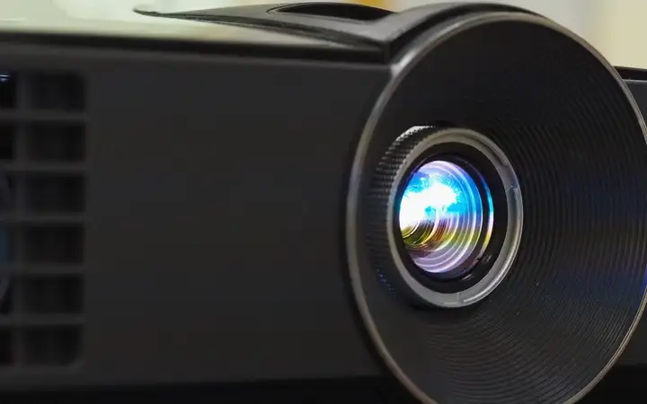 Close up of the lens of a digital projector