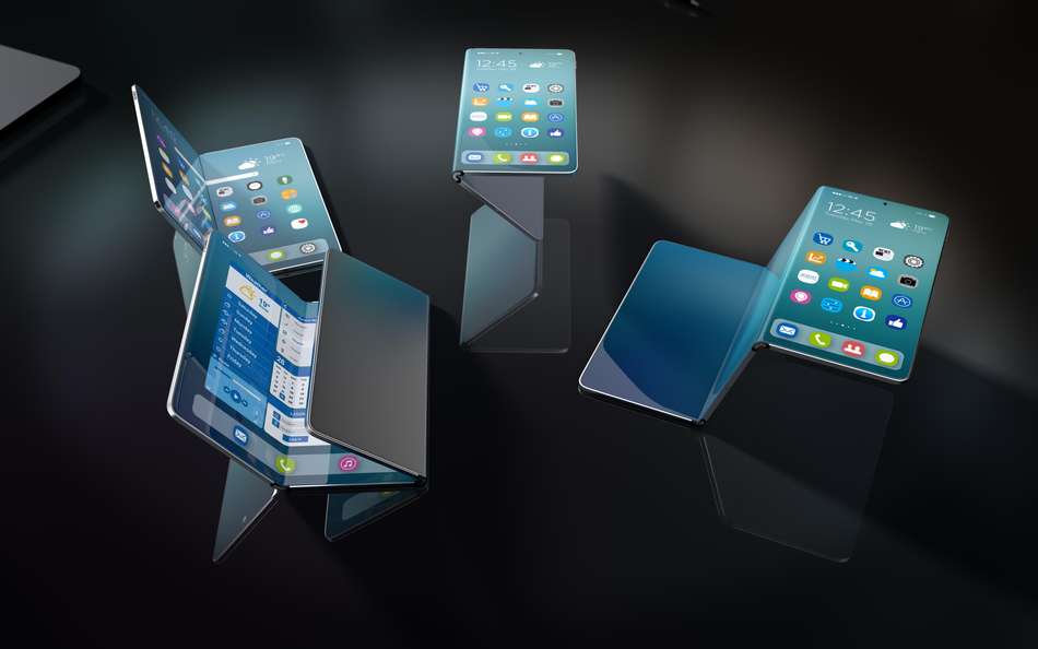 Four foldable smartphones on a dark background