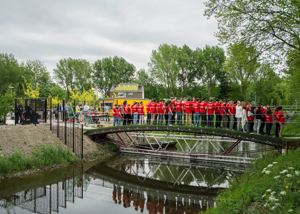 People on glass bridge at the Delft University of Technology in the Netherlands 