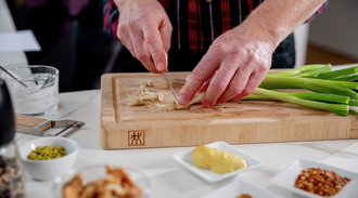 Person chops spring onions