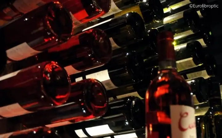 Display of wine bottles inside a retail showcase