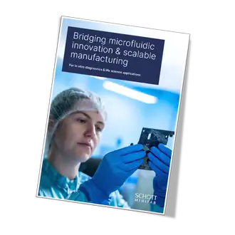 White paper cover displaying the title and an image of a scientist in a lab, holding up a microfluidic device.