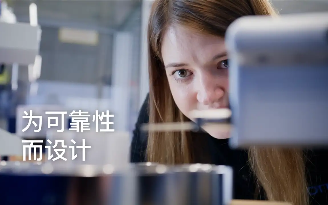 Technician inspects dimensions of a large feedthrough with precision instrumentation