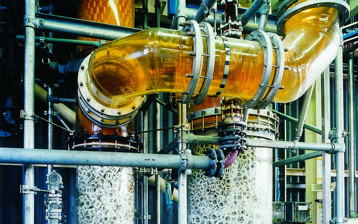 Large amber glass pipe in a chemical plant