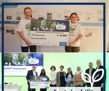 Students receiving a funding check for a climate protection project 