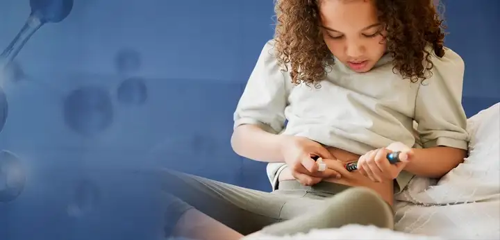 Girl injecting herself in the abdomen with insulin for diabetes