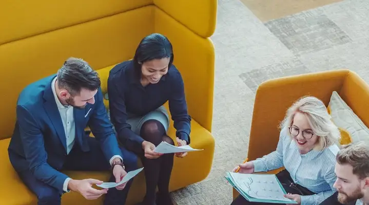 Group of office workers in an informal meeting