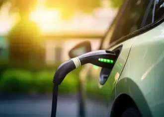 Charger connected to an electric car, charging it