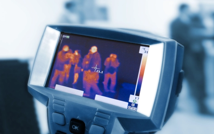 Security thermal imaging display showing heat map of a group of people