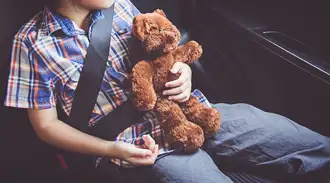 Sleeping child in a car seat