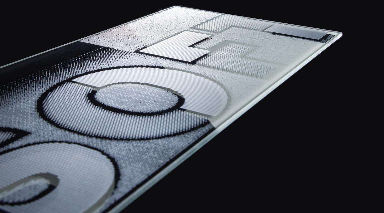 Black glass panel with the word SOFT printed using SCHOTT Duo Design Soft 