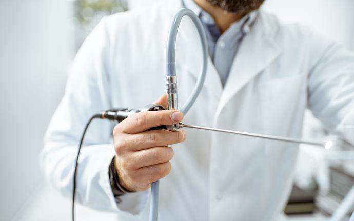 Doctor holding medical endoscope
