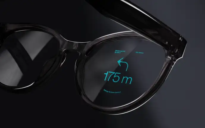 A close-up view of smart glasses displaying navigation and battery information on the lens in a sleek design.