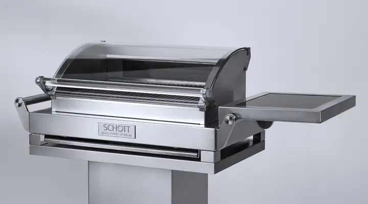 Silver grill with SCHOTT NEXTREMA® glass-ceramic viewing panel