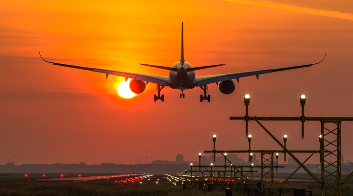 Rear view of an airplane at sunrise