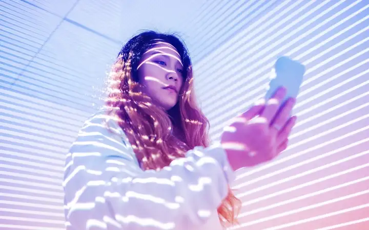 Person using smartphone for mobile sensing applications