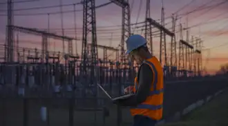 A man in front of the power generation plant