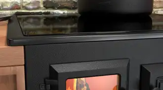 Modern wood cook stove in kitchen with brick walls