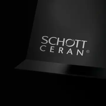 Corner of a black glass-ceramic with the SCHOTT CERAN® logo