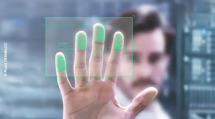 Man holding his fingers up to a fingerprint scanner