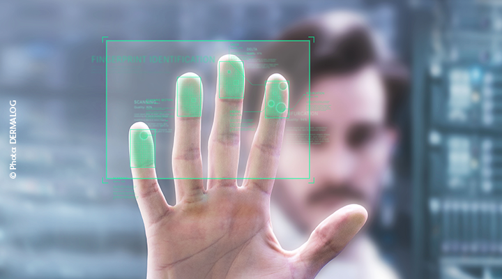Man holding his fingers up to a fingerprint scanner