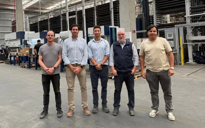 5 colleagues from Bosca standing in a production hall