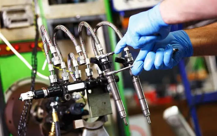 Technician repairing engine component