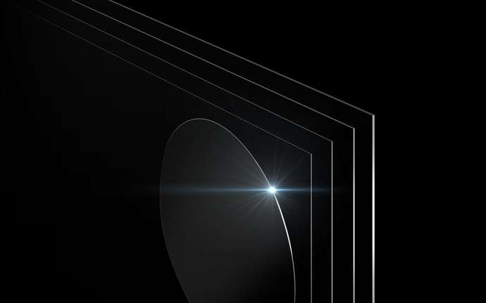 Diverse variety of panel glass and carrier wafers with black background.