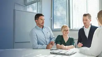 A group of people collaborating around a table.