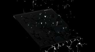 Water droplets on a glass surface showcasing coating with hydrophobic properties.