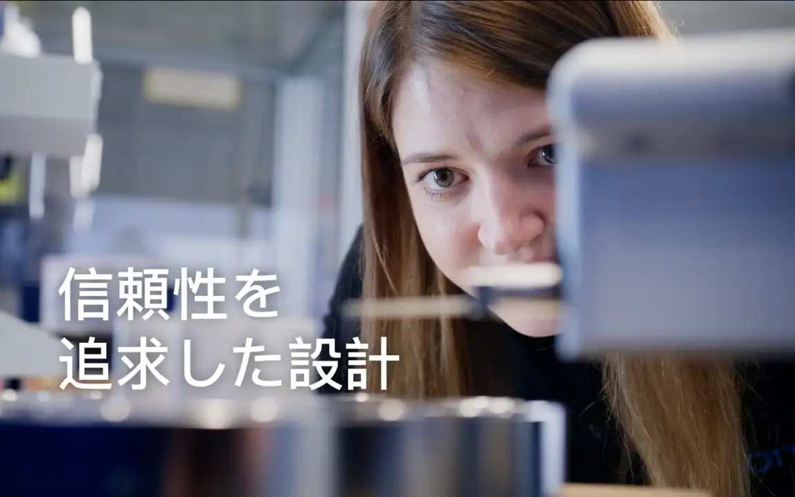 Technician inspects dimensions of a large feedthrough with precision instrumentation