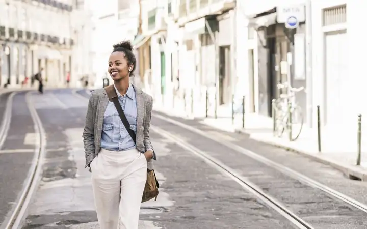 young-woman-with-wireless-earphones-in-Lissabon.jpg