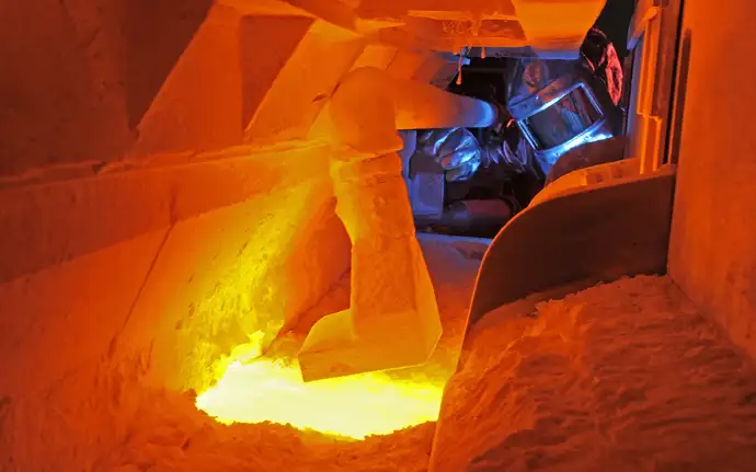 One engineer looking into the glass melting tank