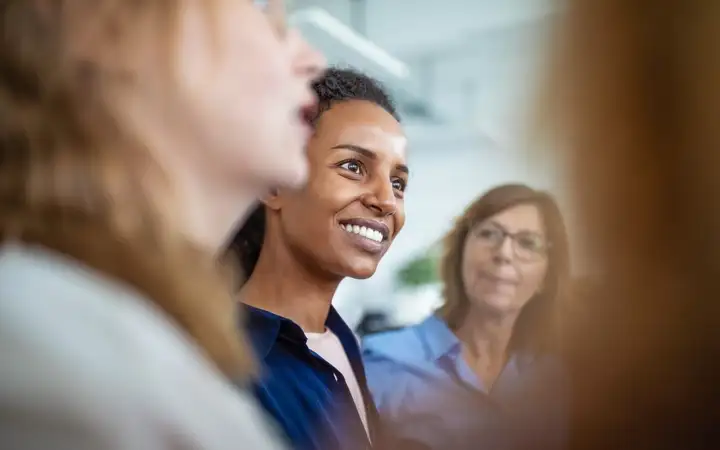 Office workers talking together