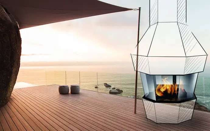 Simulación de chimenea exterior SCHOTT ROBAX® con vitrocerámicas planas en una terraza junto al mar