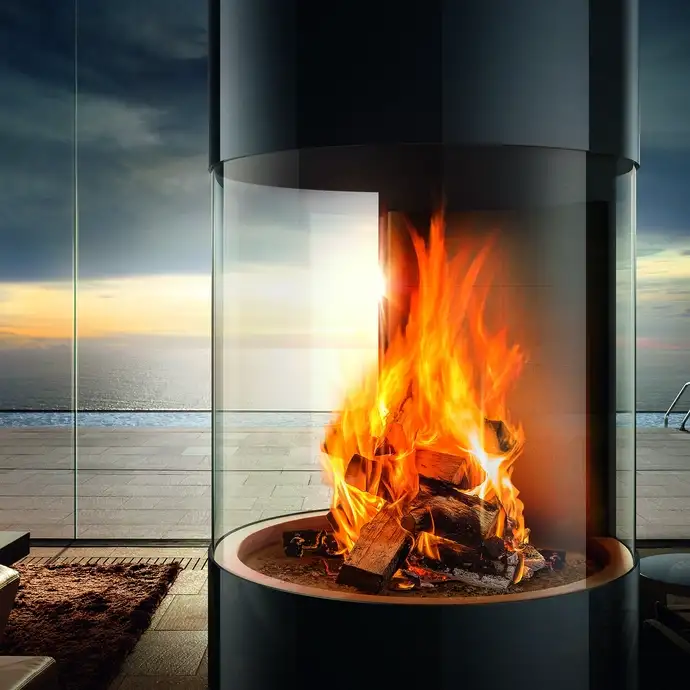 Large fireplace with round viewing-panels in front of a scenic view