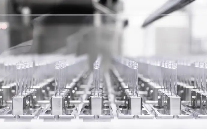 Glass syringe barrels on a production line