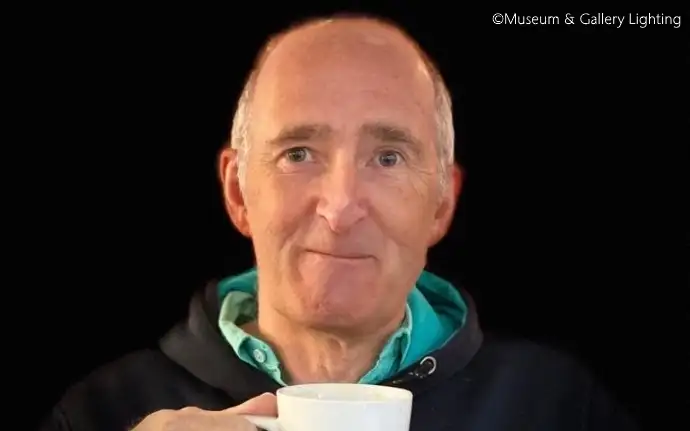 Phillip Reddiough, Managing Director of Museum & Gallery Lighting Ltd, holding a white mug