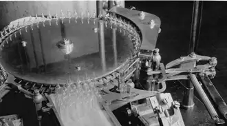   Black and white image of early SCHOTT Pharma glass ampoules processing equipment