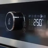 Glass control panel of a domestic oven with temperature control