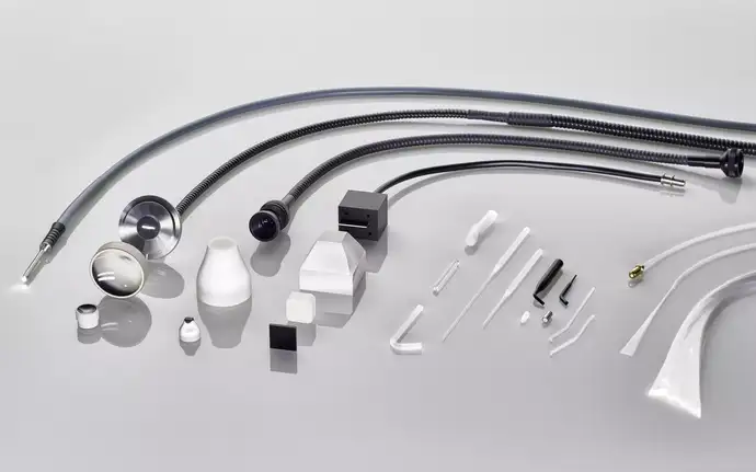 Fiber optic assembly components including fibers, connectors, sheathings and different geometries